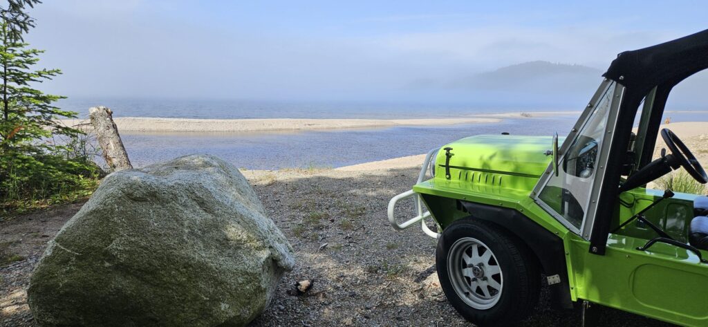 A Mini Moke overlooking a fogger Lake Superior