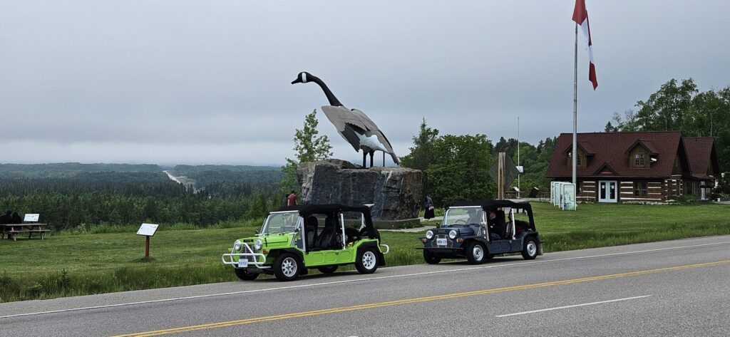 Two Mini Mokes in front of the famous Canada Goose attraction in Wawa, Ontario
