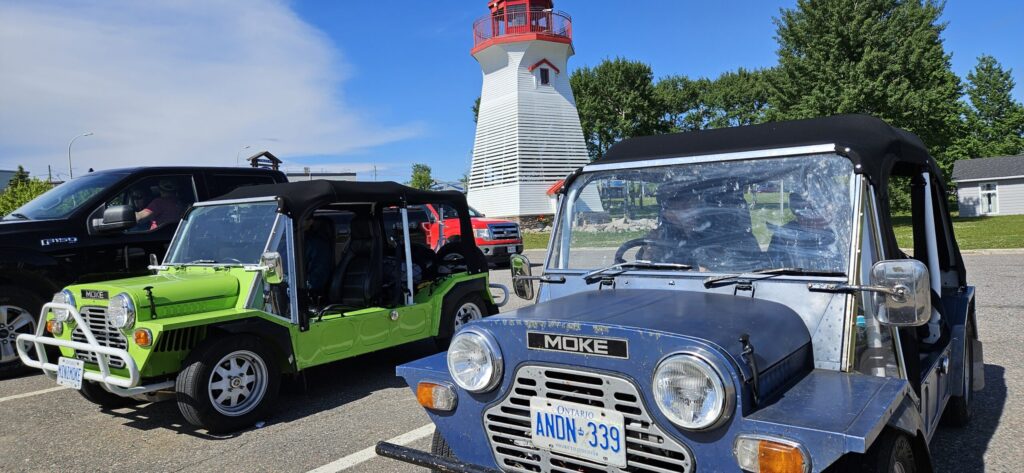 Two Mini Mokes parked at the lighthouse attraction at Terrace Bay, Ontario
