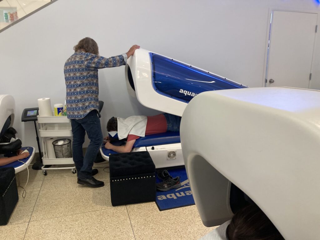A man taking a aqua massage